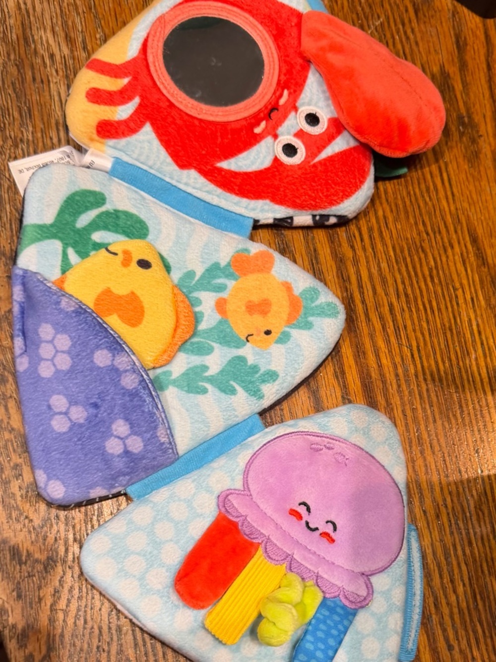 Melissa & Doug Ocean Tummy Time Triangle Baby Toy in Orange, Red, Blue, Yellow